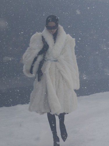 A model in a white Balenciaga fur coat 